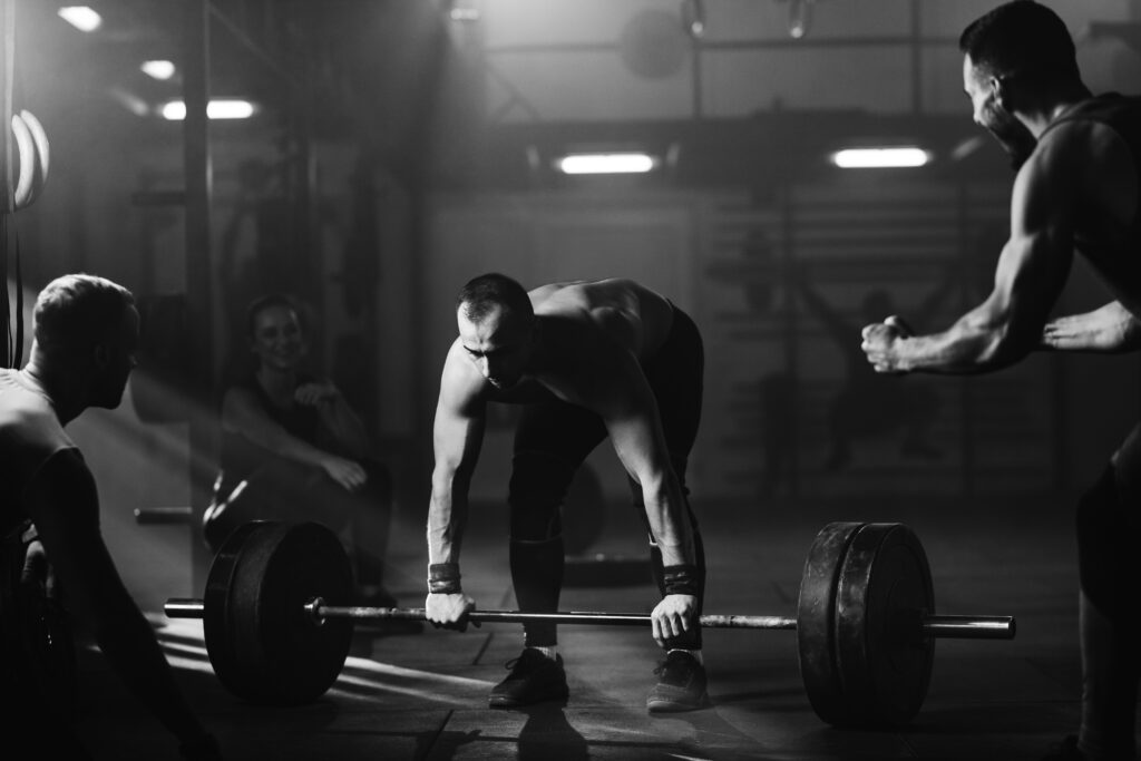 Muscular build man exercising deadlift